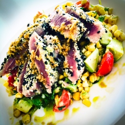 wasabi & sesame crusted tuna, with avocado, corn, tomato and coriander salad served with a ginger, soy and lemon vinaigrette